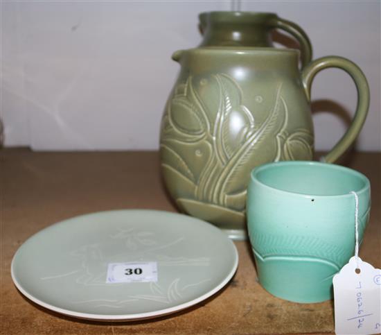 Two Susie Cooper incised green-glazed pottery jugs and two similar items(-)